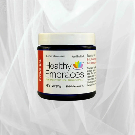 Healthy Embraces Extinguish Cooling Comfort Cream in a white jar with a blue lid, showing the product label and cream inside.