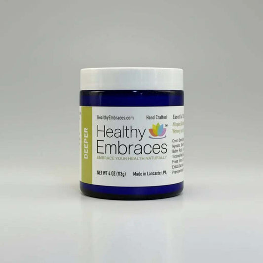 Healthy Embraces Deeper Muscle Comfort Cream in a 4oz jar, showing the cream's smooth texture and packaging.