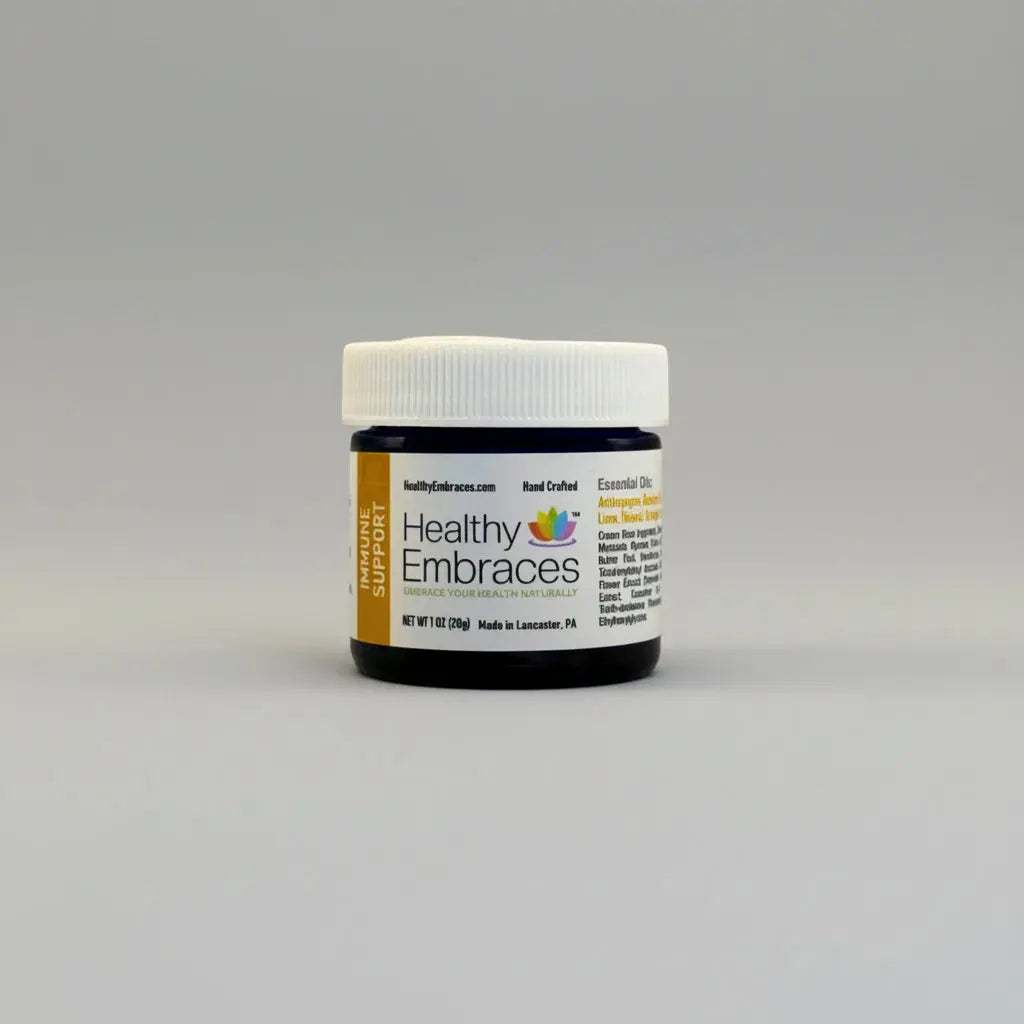 Healthy Embraces immune support cream in a 4oz jar, showing the creamy texture and labeling on the product container.