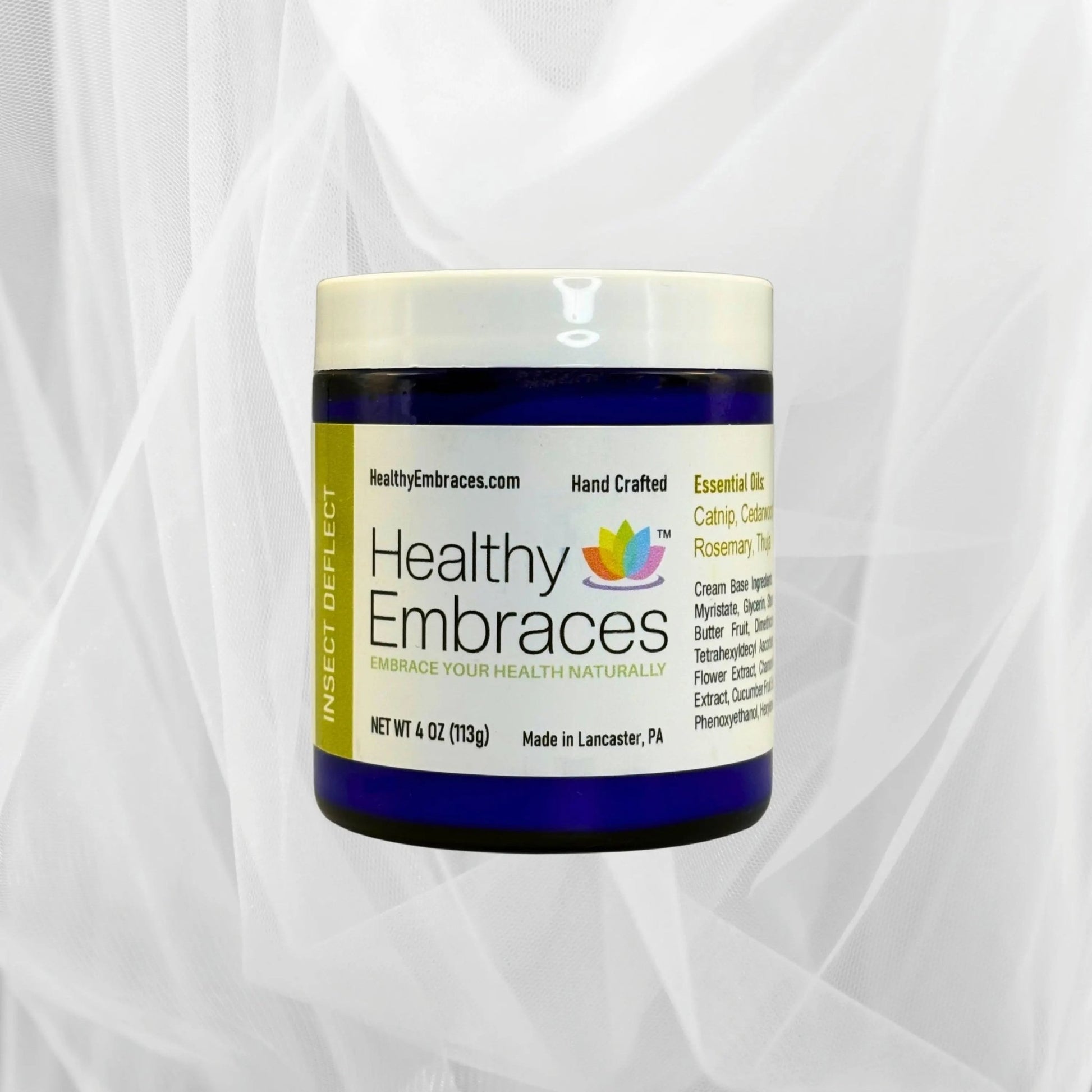 Healthy Embraces Insect Deflect Cream in a jar, showcasing a soothing skincare cream for insect protection.