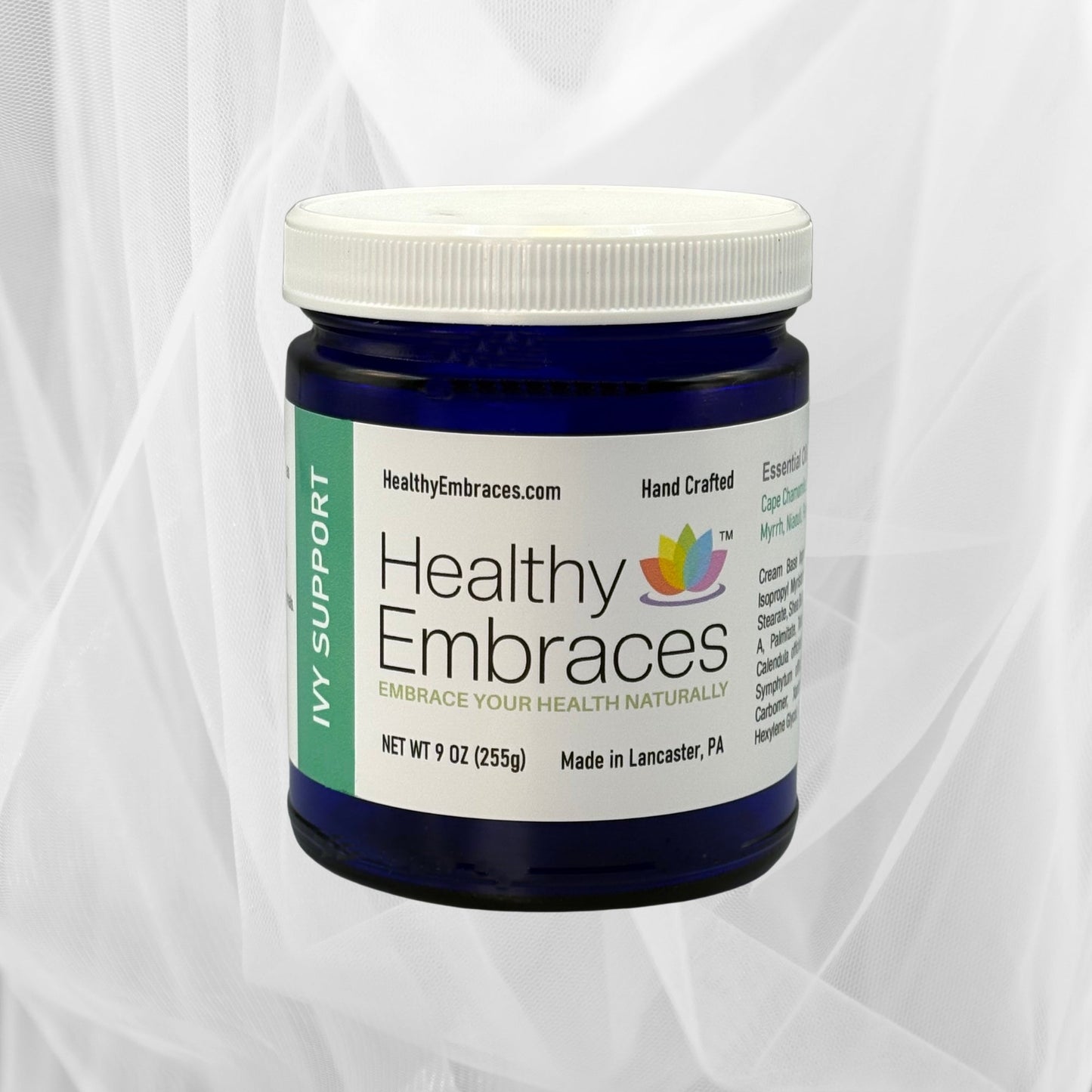 Healthy Embraces Ivy Support Cream jar showing creamy texture and herbal ingredients for soothing skin support.