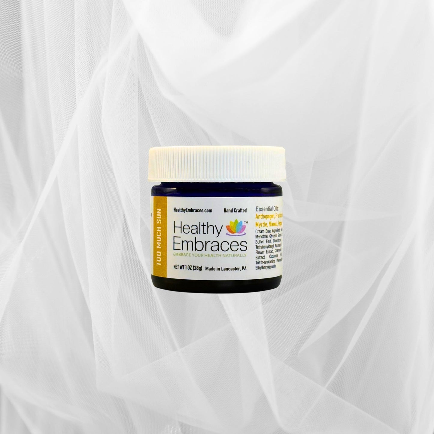Healthy Embraces Too Much Sun Cream in a white cream jar with a green label, designed to protect skin from sun damage.